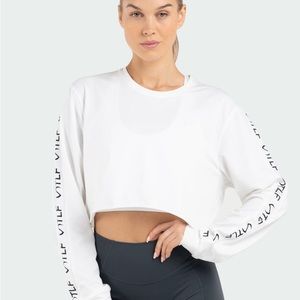 NWT TLF Long Sleeve Crop Tee Size Medium. Color White. New!